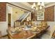 Formal dining area featuring a large table, set for a meal, with elegant chairs and classic decor at 5901 Charleycote Dr, Raleigh, NC 27614