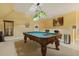 Game room with a distinctive pool table, lighting, and wall decor at 5901 Charleycote Dr, Raleigh, NC 27614