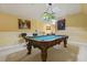 Finished game room featuring a pool table, seating, and stylish decor at 5901 Charleycote Dr, Raleigh, NC 27614