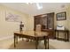 The office includes a skylight, wooden desk, and built-in shelving at 5901 Charleycote Dr, Raleigh, NC 27614