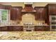 Gourmet kitchen showcasing high-end appliances and granite countertops at 5901 Charleycote Dr, Raleigh, NC 27614
