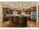 Gourmet kitchen showcasing a large island with seating and custom cabinetry at 5901 Charleycote Dr, Raleigh, NC 27614