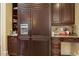 View of kitchen featuring Sub-Zero refrigerator and custom cabinetry at 5901 Charleycote Dr, Raleigh, NC 27614