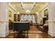 Elegant living room features a coffered ceiling, chandelier, and traditional furnishings at 5901 Charleycote Dr, Raleigh, NC 27614