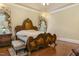 This main bedroom features an ornate bed frame, recessed lighting, and hardwood flooring at 5901 Charleycote Dr, Raleigh, NC 27614