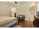 This main bedroom boasts a tray ceiling, hardwood floors, and access to the ensuite bathroom at 5901 Charleycote Dr, Raleigh, NC 27614