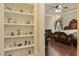 Main bedroom suite featuring hardwood floors, a decorative ceiling fan, and custom furniture at 5901 Charleycote Dr, Raleigh, NC 27614