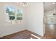 Bright dining area with large windows providing natural light, offering a clear view of the outdoors at 604 Natchez Trace, Fuquay Varina, NC 27526