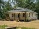 Charming single-story home with a welcoming front porch and light gray siding at 604 Natchez Trace, Fuquay Varina, NC 27526