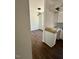 Kitchen area featuring white cabinets and view into dining area at 604 Natchez Trace, Fuquay Varina, NC 27526