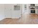 Well-lit kitchen boasting stainless steel appliances and white cabinets and granite countertops at 604 Natchez Trace, Fuquay Varina, NC 27526