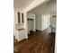 Open living space featuring wood-look floors, white cabinetry, and closet at 604 Natchez Trace, Fuquay Varina, NC 27526