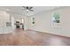 Spacious living room with wood floors, showcasing an open layout that flows into the kitchen area at 604 Natchez Trace, Fuquay Varina, NC 27526