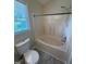 Bathroom featuring a tub, toilet, and a window, designed for relaxation and convenience at 607 Wahlbrink Dr, Wake Forest, NC 27587