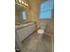 Bright bathroom with double sink vanity, natural light, and a neutral color palette at 607 Wahlbrink Dr, Wake Forest, NC 27587