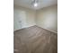 Bedroom featuring neutral carpet, a ceiling fan, and a closet, creating a simple and comfortable space at 607 Wahlbrink Dr, Wake Forest, NC 27587