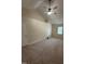 Spacious bedroom with neutral carpet, a vaulted ceiling, a ceiling fan, and a bright window at 607 Wahlbrink Dr, Wake Forest, NC 27587