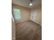 Bedroom with carpet flooring, double door closet, and a window offering natural light at 607 Wahlbrink Dr, Wake Forest, NC 27587
