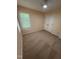 Bedroom featuring neutral carpet, a window, and a closet, creating a comfortable and inviting space at 607 Wahlbrink Dr, Wake Forest, NC 27587