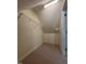 Walk-in closet offering plenty of storage with carpeted floors, wire shelving, and overhead lighting at 607 Wahlbrink Dr, Wake Forest, NC 27587