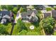 Aerial view of the property showcasing the home's layout, backyard with firepit, and surrounding landscape at 608 Driftwood Dr, Gibsonville, NC 27249