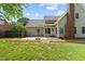 Well-kept backyard featuring a cozy patio area, perfect for outdoor entertaining and relaxation at 608 Driftwood Dr, Gibsonville, NC 27249