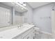Bathroom boasts a modern vanity with a marble countertop, a toilet, and a mirror at 608 Driftwood Dr, Gibsonville, NC 27249