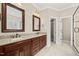 Bathroom featuring double vanity with granite countertops and tile flooring at 608 Driftwood Dr, Gibsonville, NC 27249