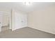 Neutral bedroom with carpeted floor, and closet with double doors, perfect for relaxation and personalization at 608 Driftwood Dr, Gibsonville, NC 27249