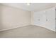 Bedroom with carpet and a closet with double doors and neutral walls for personalization at 608 Driftwood Dr, Gibsonville, NC 27249