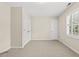 Bedroom features carpet, plantation shutters, closet with double doors, and neutral tones at 608 Driftwood Dr, Gibsonville, NC 27249