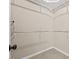 Empty walk-in closet featuring tile flooring and shelving racks for storage at 608 Driftwood Dr, Gibsonville, NC 27249