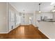 Dining area with hardwood floors and views of the kitchen and back yard at 608 Driftwood Dr, Gibsonville, NC 27249