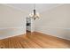 Dining room with hardwood floors and a decorative chandelier at 608 Driftwood Dr, Gibsonville, NC 27249