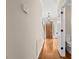 Inviting hallway showcasing hardwood floors and a glimpse of the front door at 608 Driftwood Dr, Gibsonville, NC 27249