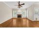 Spacious living room with hardwood floors, a fireplace, and natural light at 608 Driftwood Dr, Gibsonville, NC 27249