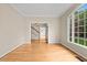 Bright living room featuring hardwood floors and large windows providing ample natural light at 608 Driftwood Dr, Gibsonville, NC 27249
