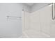 Clean and modern shower-tub combination with white tile and fixtures at 608 Driftwood Dr, Gibsonville, NC 27249