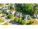 Aerial view of white home showcasing the lawn, driveway, and neighborhood at 612 Lakeview Ave, Wake Forest, NC 27587