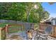 Inviting back deck featuring comfortable seating and a fire pit, creating a cozy outdoor space at 612 Lakeview Ave, Wake Forest, NC 27587