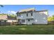 White home's backyard features a wood deck, large lawn, and privacy fence at 612 Lakeview Ave, Wake Forest, NC 27587