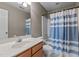 Cozy bathroom featuring a shower-tub combination and a single sink vanity with wood finish at 612 Lakeview Ave, Wake Forest, NC 27587