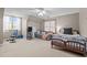 Bright bedroom featuring a bed, sofa, and exercise equipment, offering versatile space at 612 Lakeview Ave, Wake Forest, NC 27587