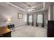 Bedroom featuring a tray ceiling, natural light, and neutral walls, creating a peaceful retreat at 612 Lakeview Ave, Wake Forest, NC 27587