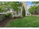 Charming screened porch overlooking the landscaped backyard, perfect for outdoor relaxation and entertaining at 707 Sasser St, Raleigh, NC 27604