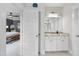 Bright bathroom featuring granite countertops and a view into the main bedroom at 707 Sasser St, Raleigh, NC 27604
