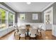 Elegant dining room with stylish chairs, hardwood floors, and lots of natural light at 707 Sasser St, Raleigh, NC 27604