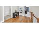 Open hallway featuring beautiful hardwood floors and a view into the bedrooms at 707 Sasser St, Raleigh, NC 27604