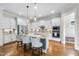 Bright kitchen featuring stainless steel appliances, granite counters, and a large island at 707 Sasser St, Raleigh, NC 27604
