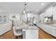 Spacious kitchen with large island, granite countertops, and stainless steel appliances at 707 Sasser St, Raleigh, NC 27604